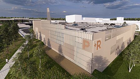 Impressie van de nieuwe P+R-garage Ede-Wageningen, gezien vanaf de westkant met station Ede-Wageningen op de achtergrond.